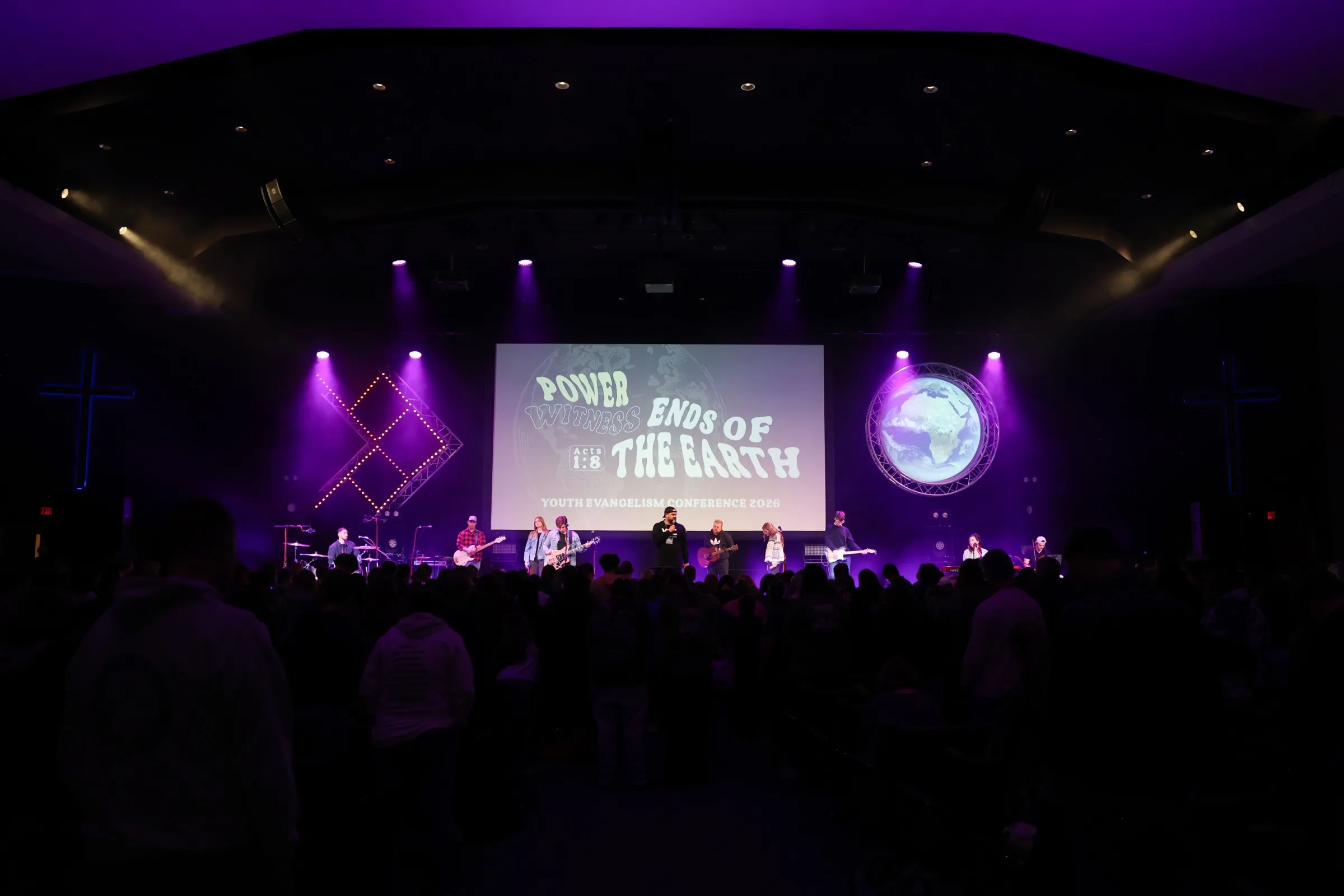 Red Letter Society leading worship for a packed room at a student conference